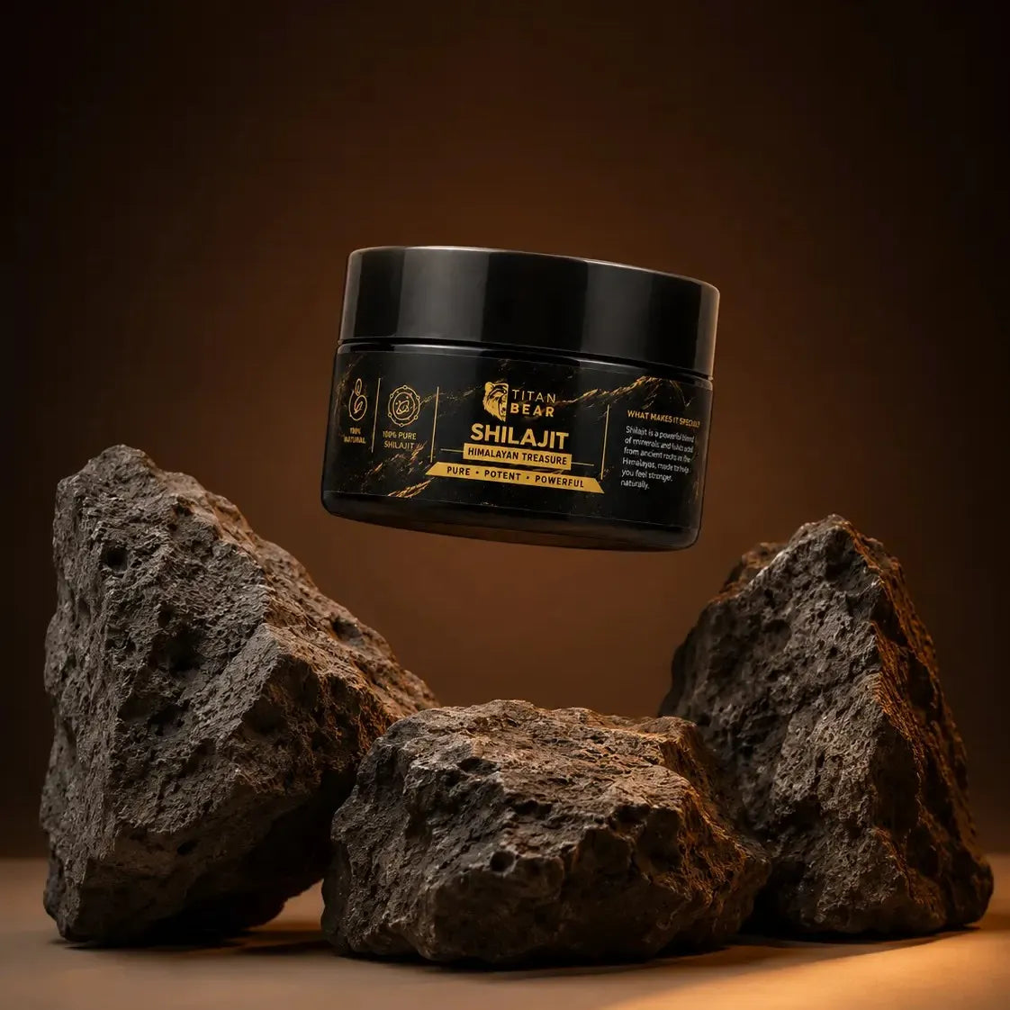Titan Bear Himalayan shilajit resin jar displayed above dark mineral rocks