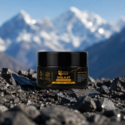 Titan Bear shilajit resin jar displayed on rocks with Himalayan mountains behind it