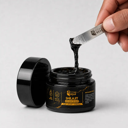 Open Titan Bear shilajit resin jar with resin on a measuring spoon